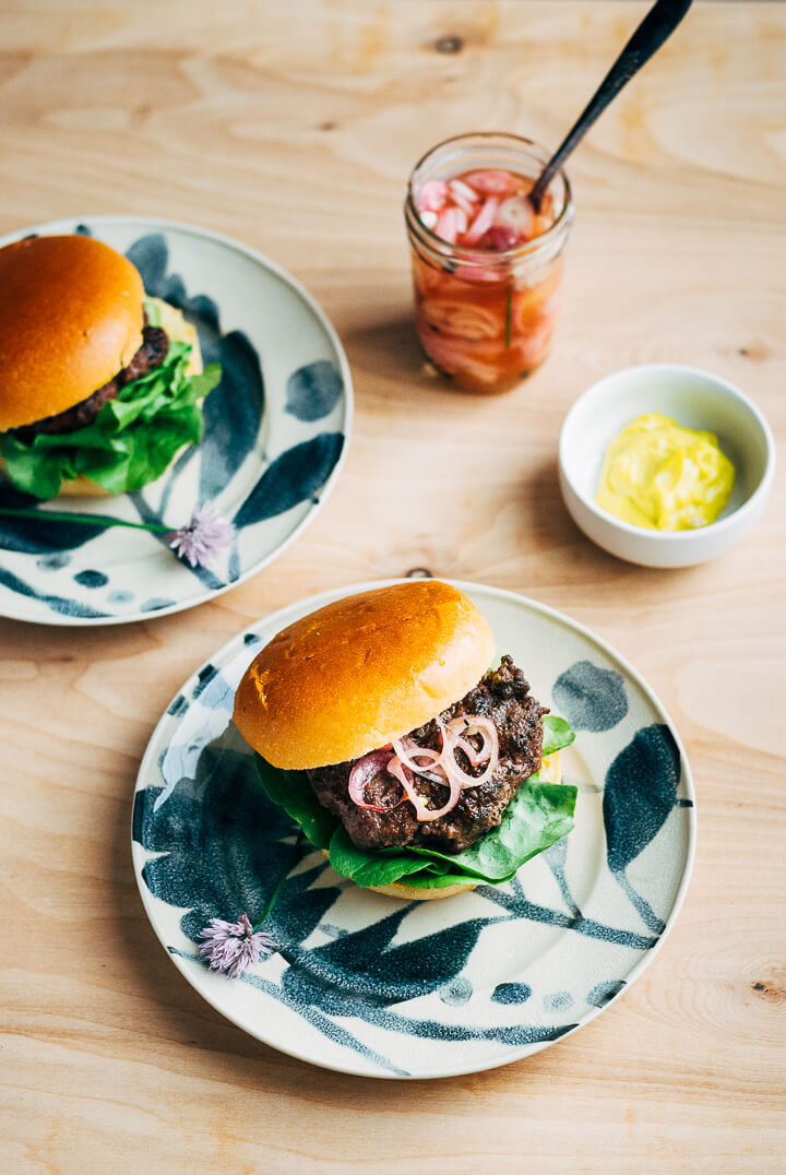 grilled grass-fed burgers with quick-pickled shallots and chive blossoms