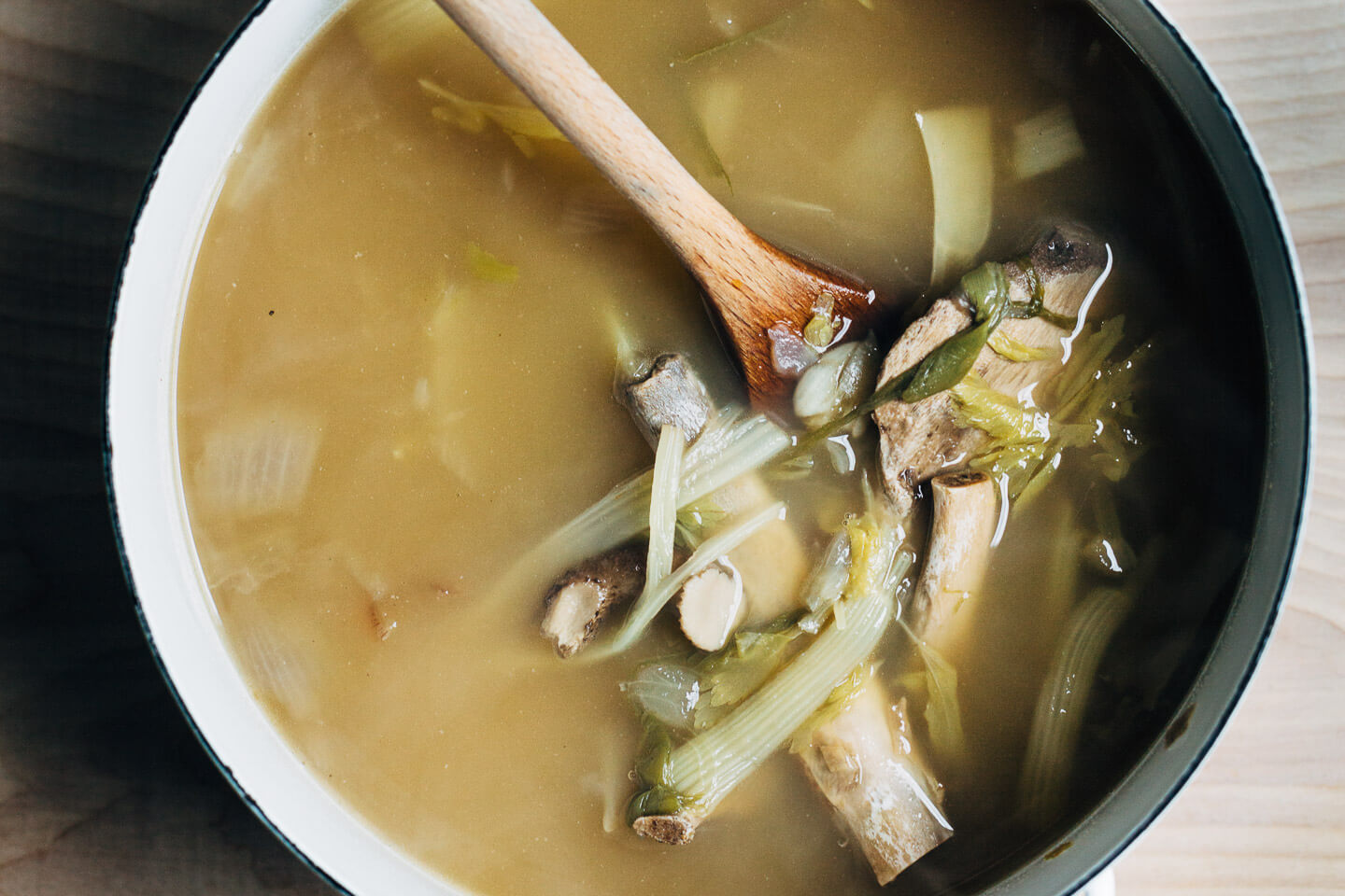 Everything you need to make rich, incredibly flavorful pork bone broth at home using raw pork bones either on the stove top or in an electric pressure cooker, or repurposing leftover pork bones for a simpler pork bone broth.