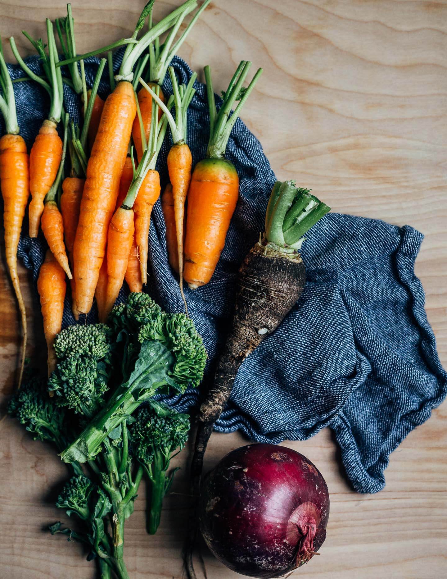 Vegetables for crudité and a red onion for making the dip. 