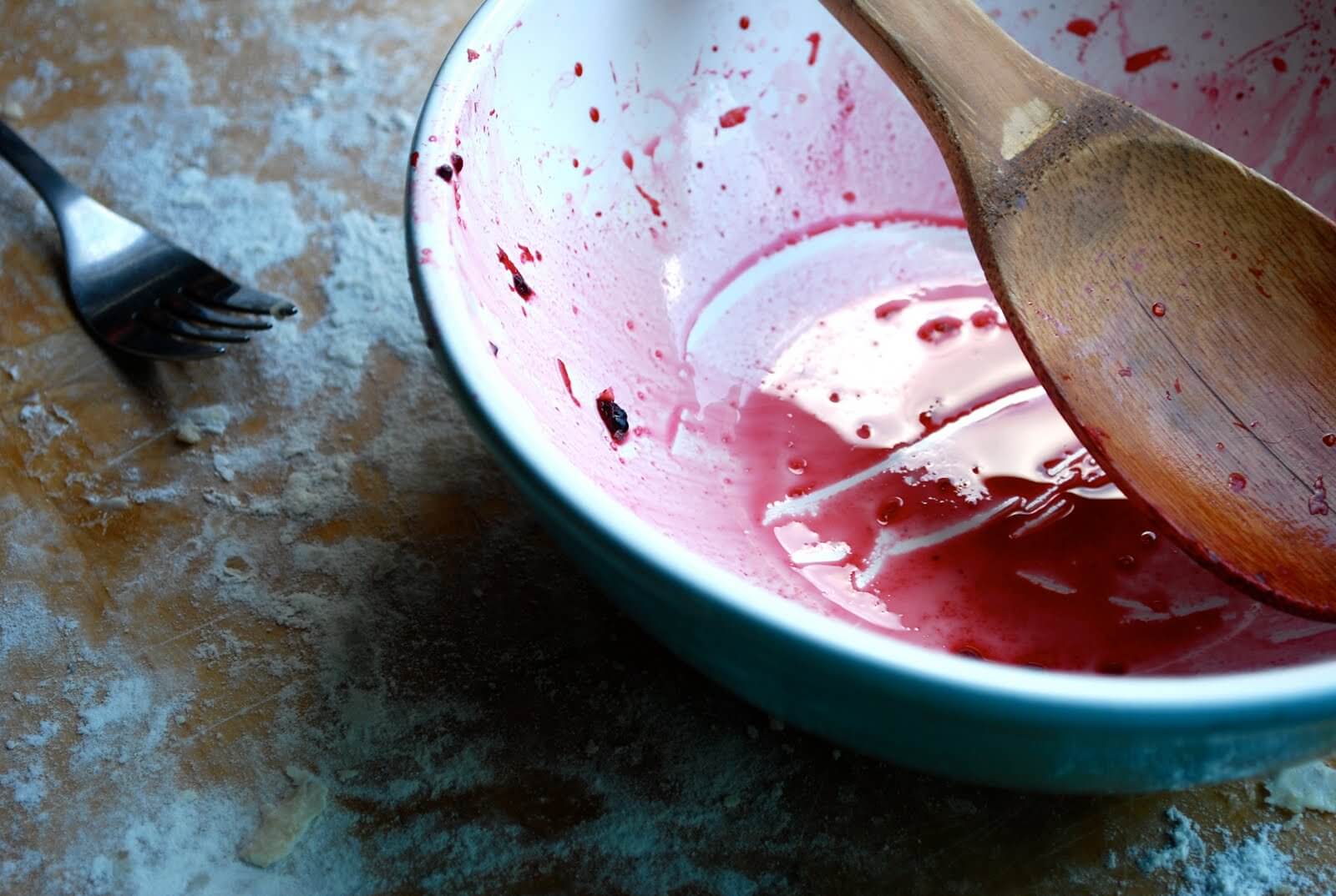 An empty bowl with black raspberry juice