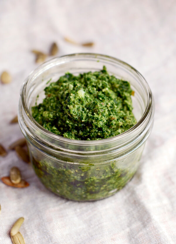 A simple kale pesto recipe made with nutty toasted pepitas and creamy Asiago cheese.
