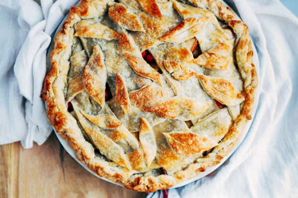 A sweet and tangy cranberry apple pie recipe with a beautiful decorative leaf crust.