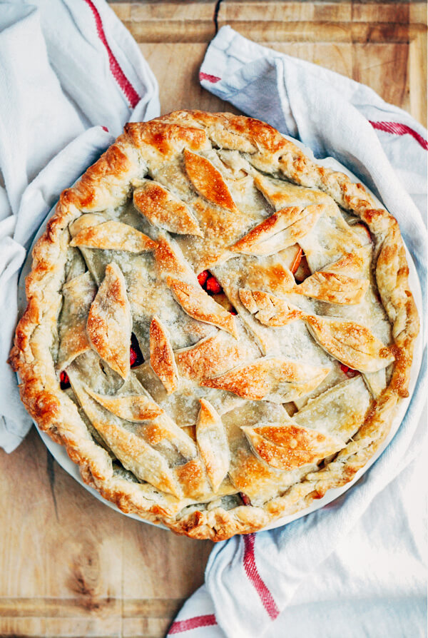 A sweet and tangy cranberry apple pie recipe with a beautiful decorative leaf crust.