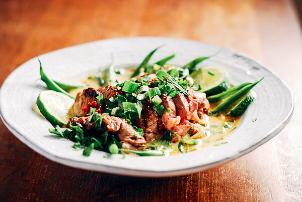 Flavorful grilled lamb tossed with tender haricot vert, and drizzled with a generously spiced coconut milk broth.