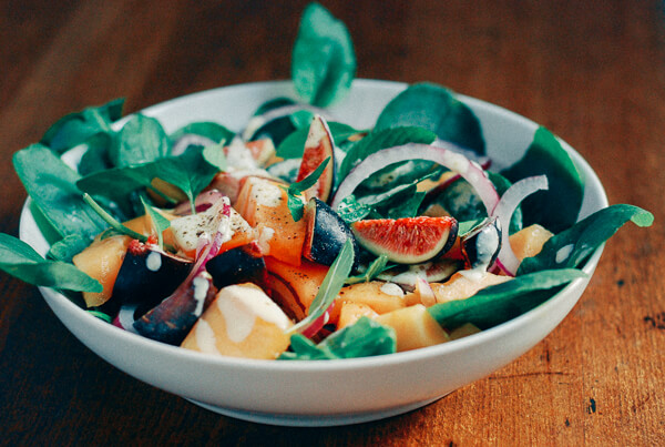 A bowl of fig and cantaloupe salad.