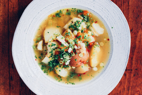 A bowl of cod and corn chowder.