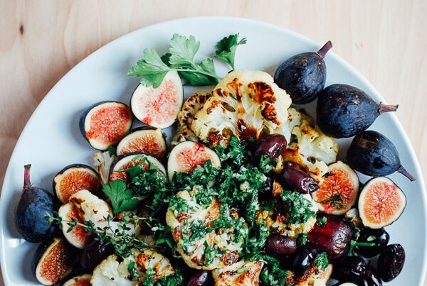A roasted cauliflower salad recipe with fresh figs, Kalamata olives, and a bright chimichurri sauce.