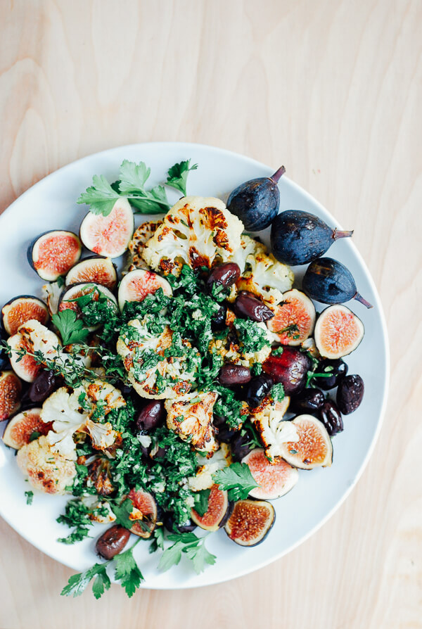 A roasted cauliflower salad recipe with fresh figs, Kalamata olives, and a bright chimichurri sauce.