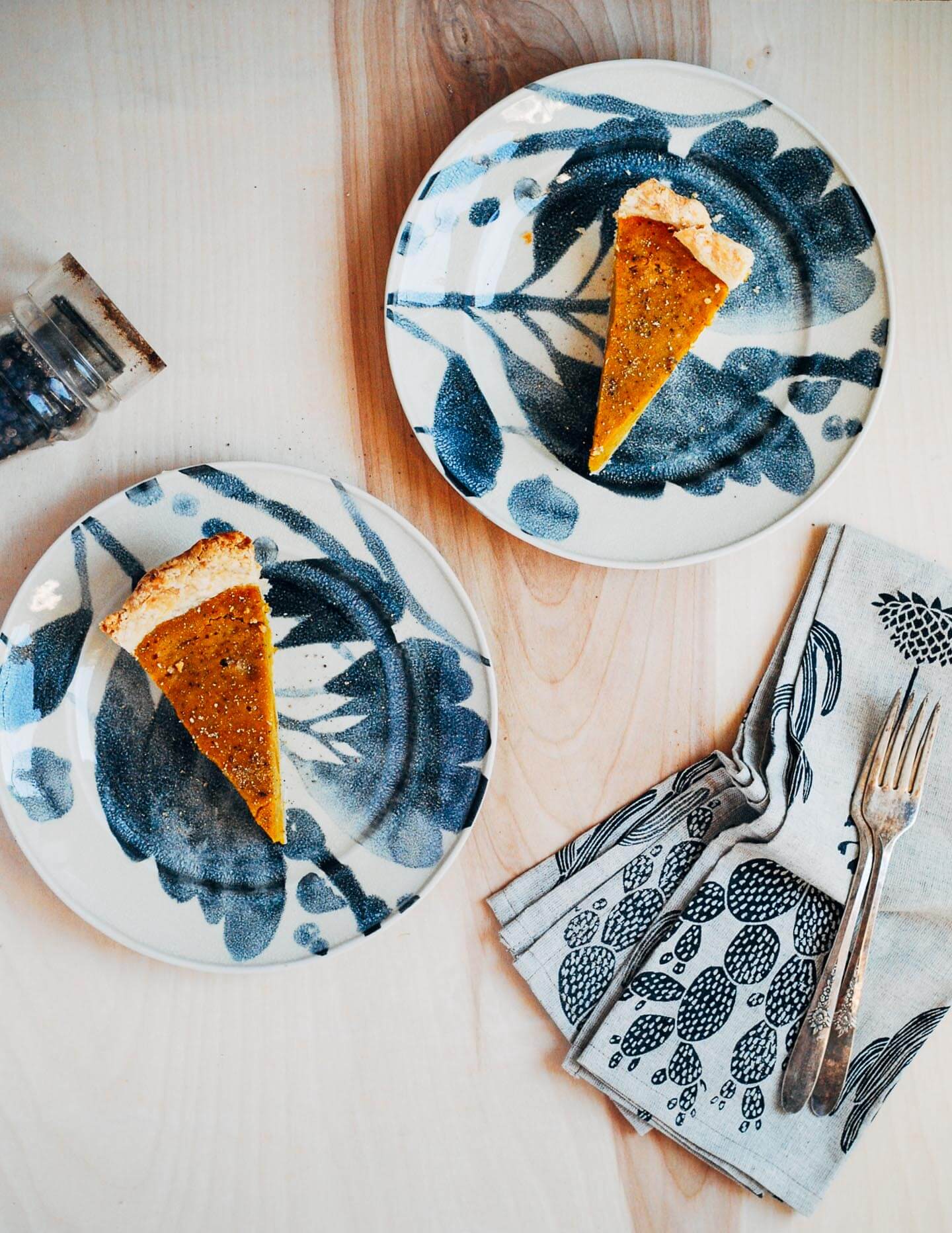 A creative twist on a classic pumpkin pie recipe, this kabocha squash pie is flecked with chipotle chili powder, black pepper, and fresh ginger.