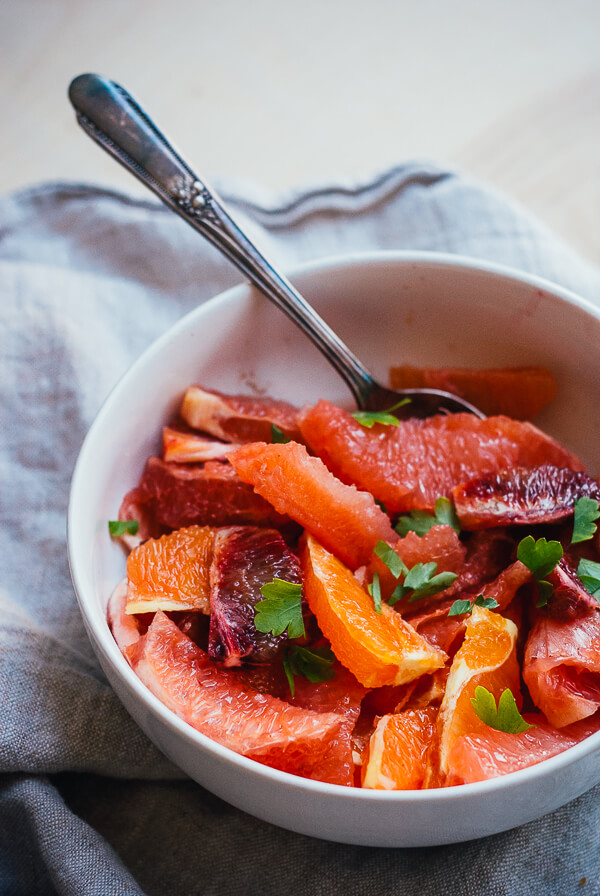 A bowl with a mixed citrus salad. 