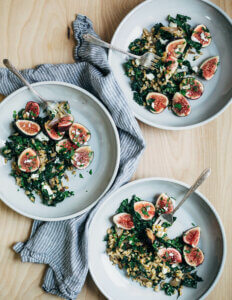 Three salad bowls with a farro and fig salad.