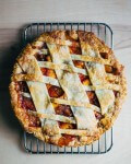 A chevron lattice peach chutney pie recipe with all the flavors of a classic peach pie, plus the pop of fresh ginger, apple cider vinegar, and spice.