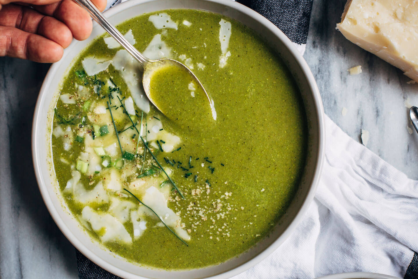 Garnish soup with shaved Parmesan, fresh chives, and white pepper. 