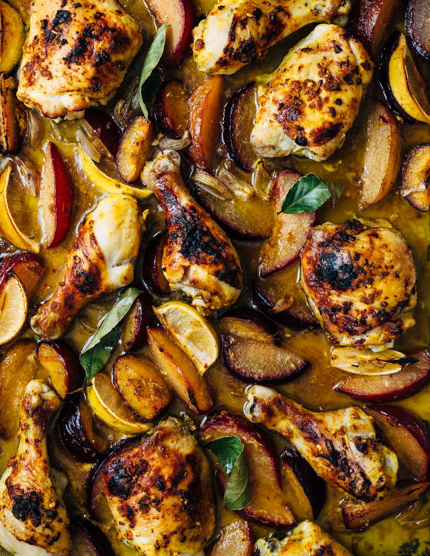 A simple sheet pan chicken and plums recipe featuring crispy saffron- and garlic-infused chicken topped with a sweet and savory plum pan sauce. 