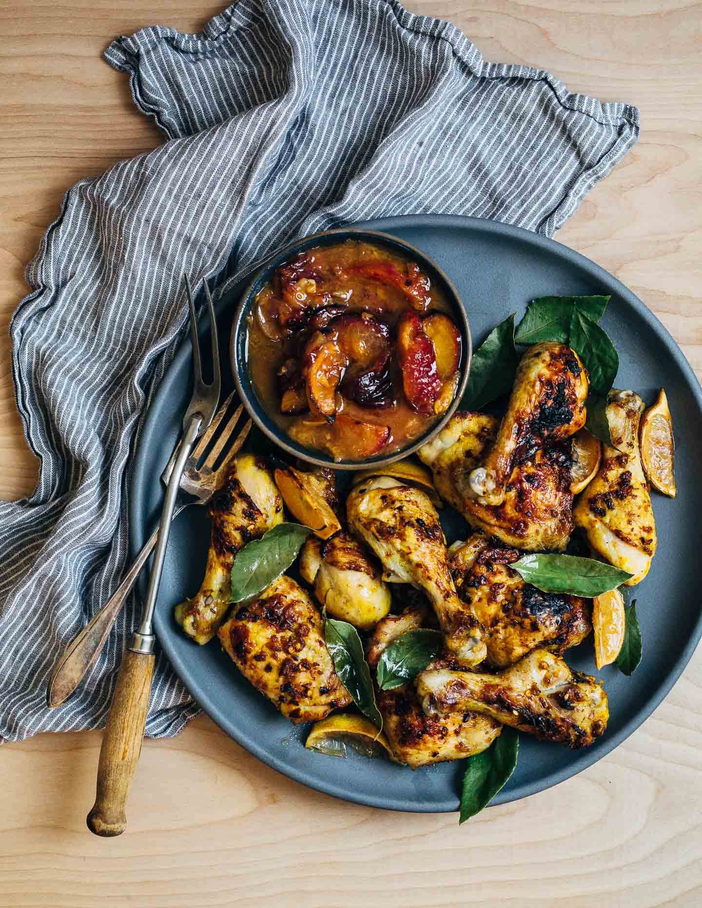 A simple sheet pan chicken and plums recipe featuring crispy saffron- and garlic-infused chicken topped with a sweet and savory plum pan sauce. 