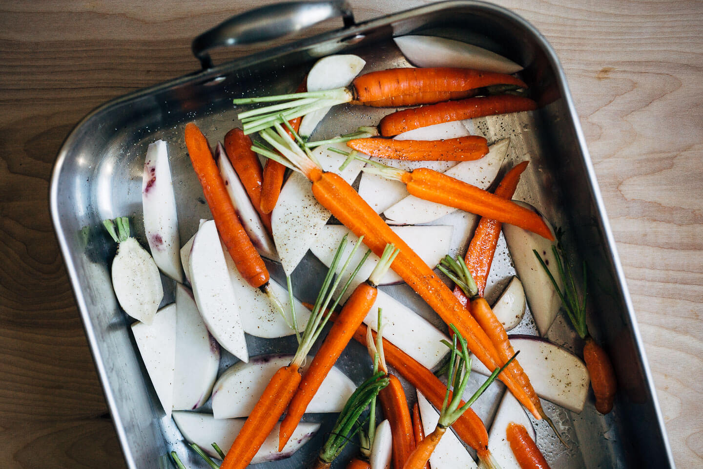 A dinner party-worthy recipe for rack of lamb roasted alongside root vegetables and served with a vibrant honey orange sauce.