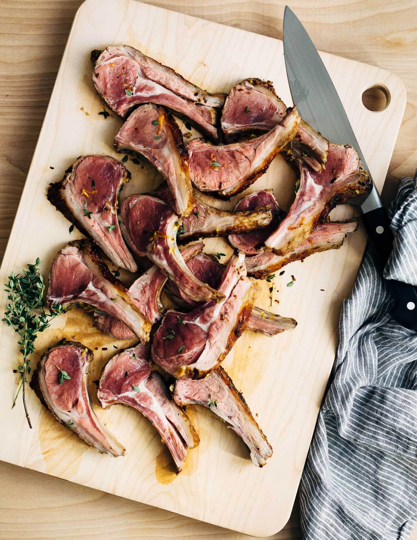 A dinner party-worthy recipe for rack of lamb roasted alongside root vegetables and served with a vibrant honey orange sauce.