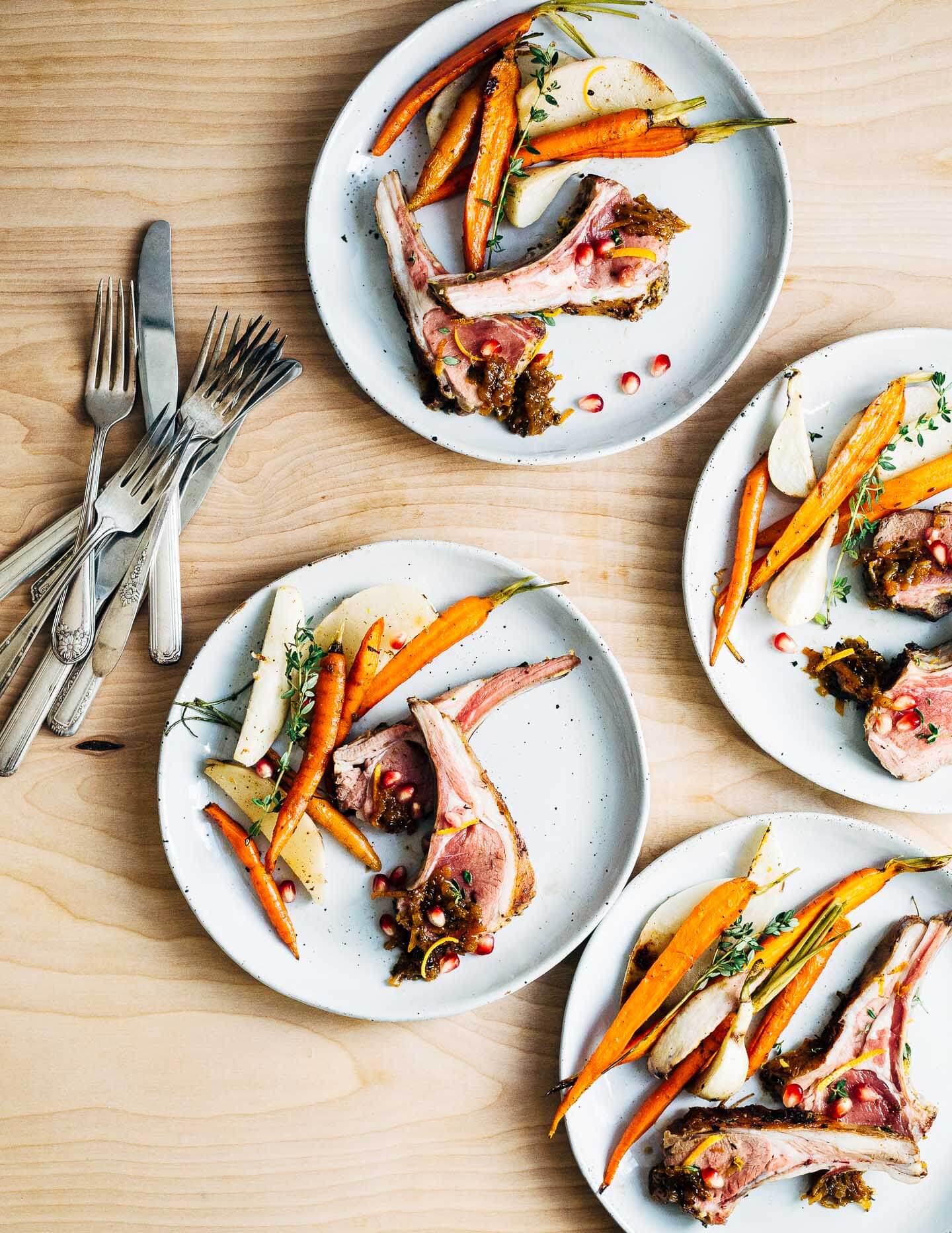 A dinner party-worthy recipe for rack of lamb roasted alongside root vegetables and served with a vibrant honey orange sauce.
