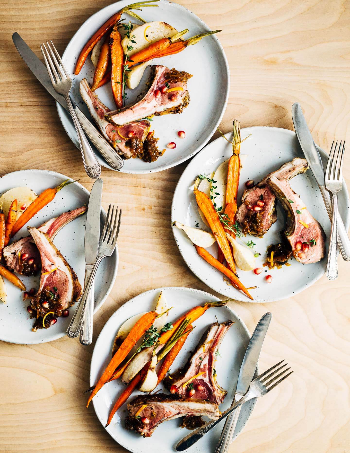 A dinner party-worthy recipe for rack of lamb roasted alongside root vegetables and served with a vibrant honey orange sauce.