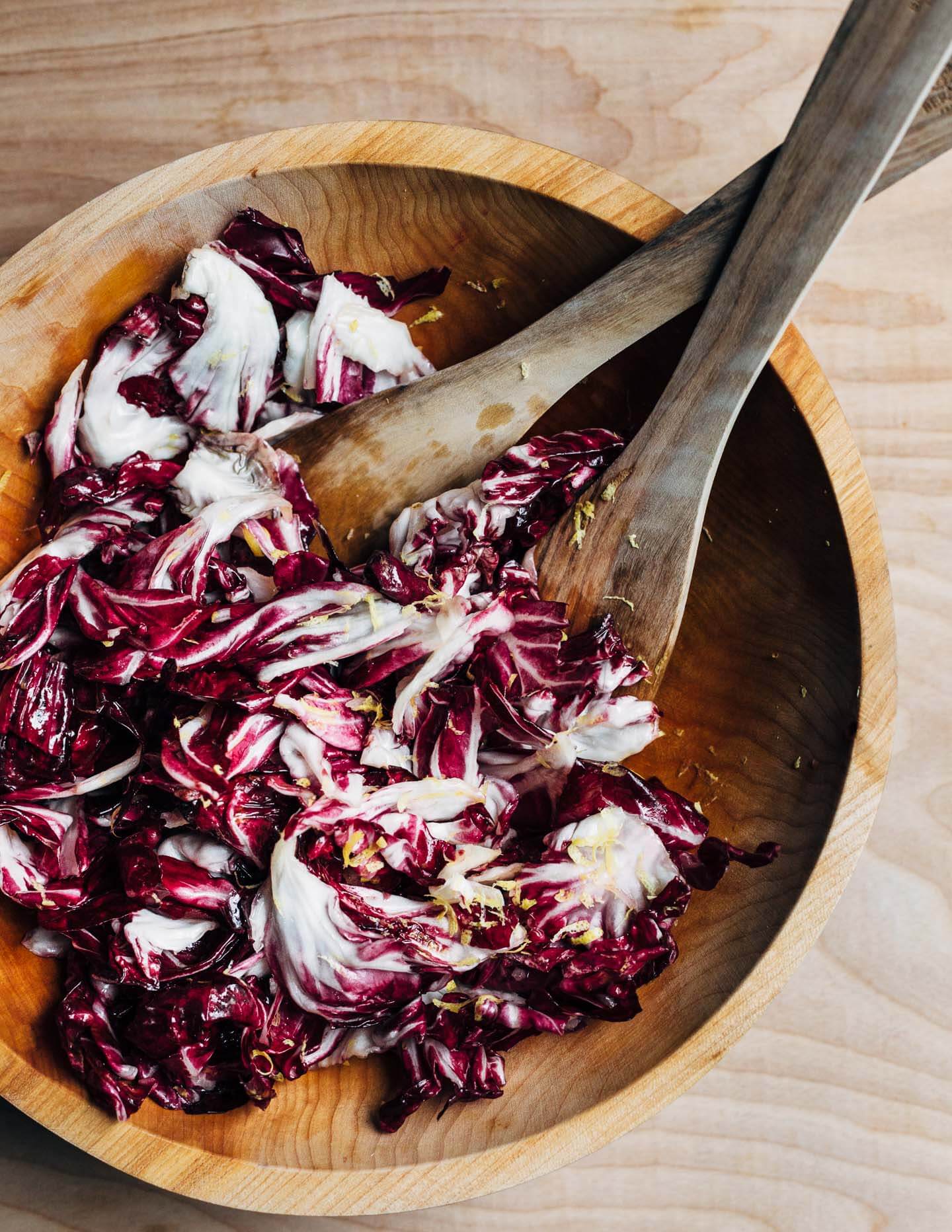 An autumnal radicchio and roasted delicata squash salad tossed in a lemon maple dressing, and topped with salty pepitas, fried sage leaves, and Parmesan.