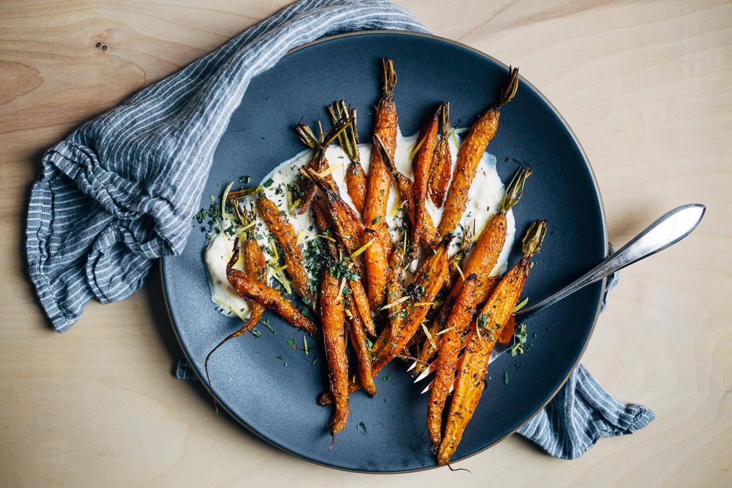 An autumnal roasted carrot salad recipe with cracked pepper and cumin crème fraîche.