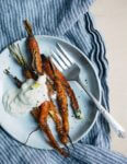 An autumnal roasted carrot salad recipe with cracked pepper and cumin crème fraîche.