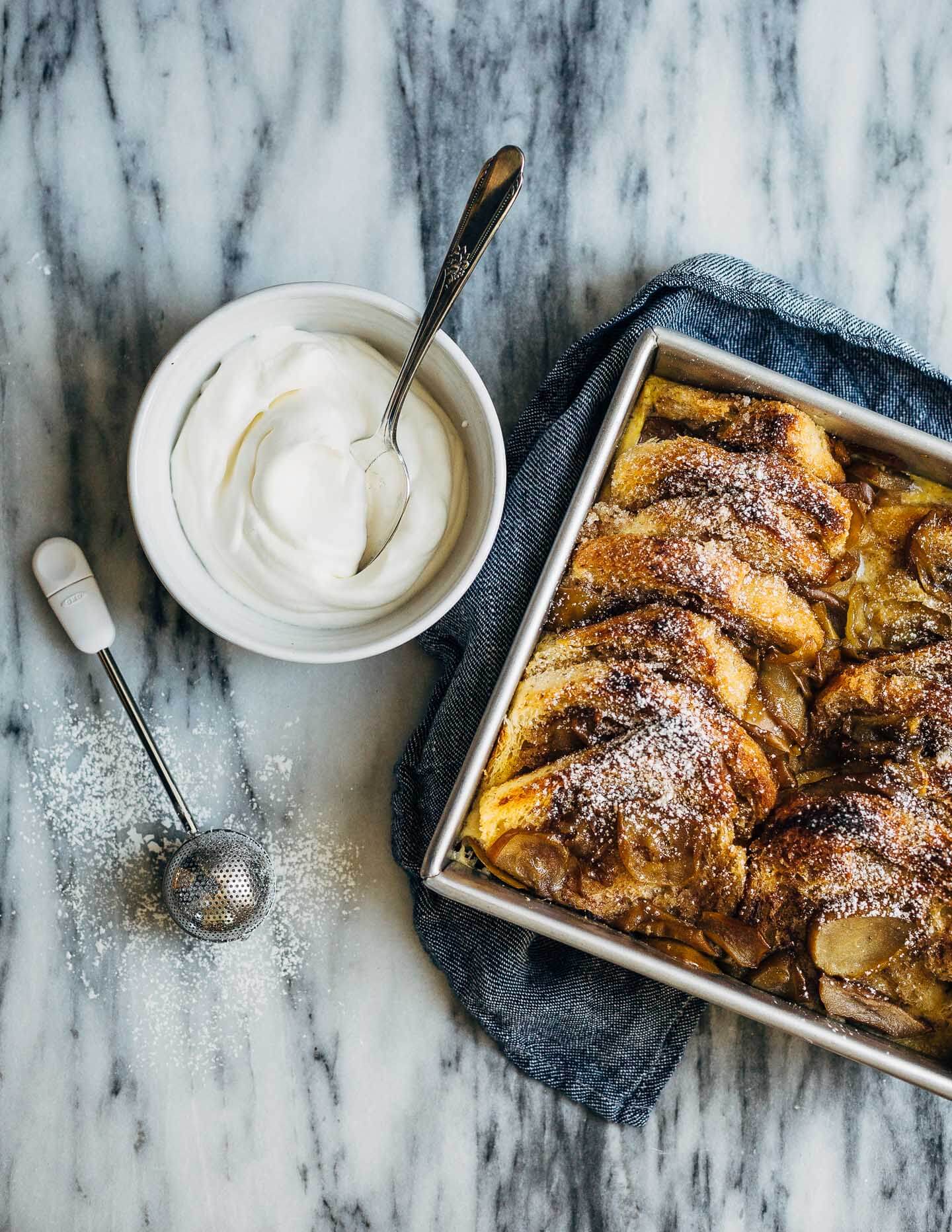 Seckel pears sautéed in brown butter syrup and slices of brioche dipped in cinnamon sugar elevate this simple seckel pear bread pudding recipe. 