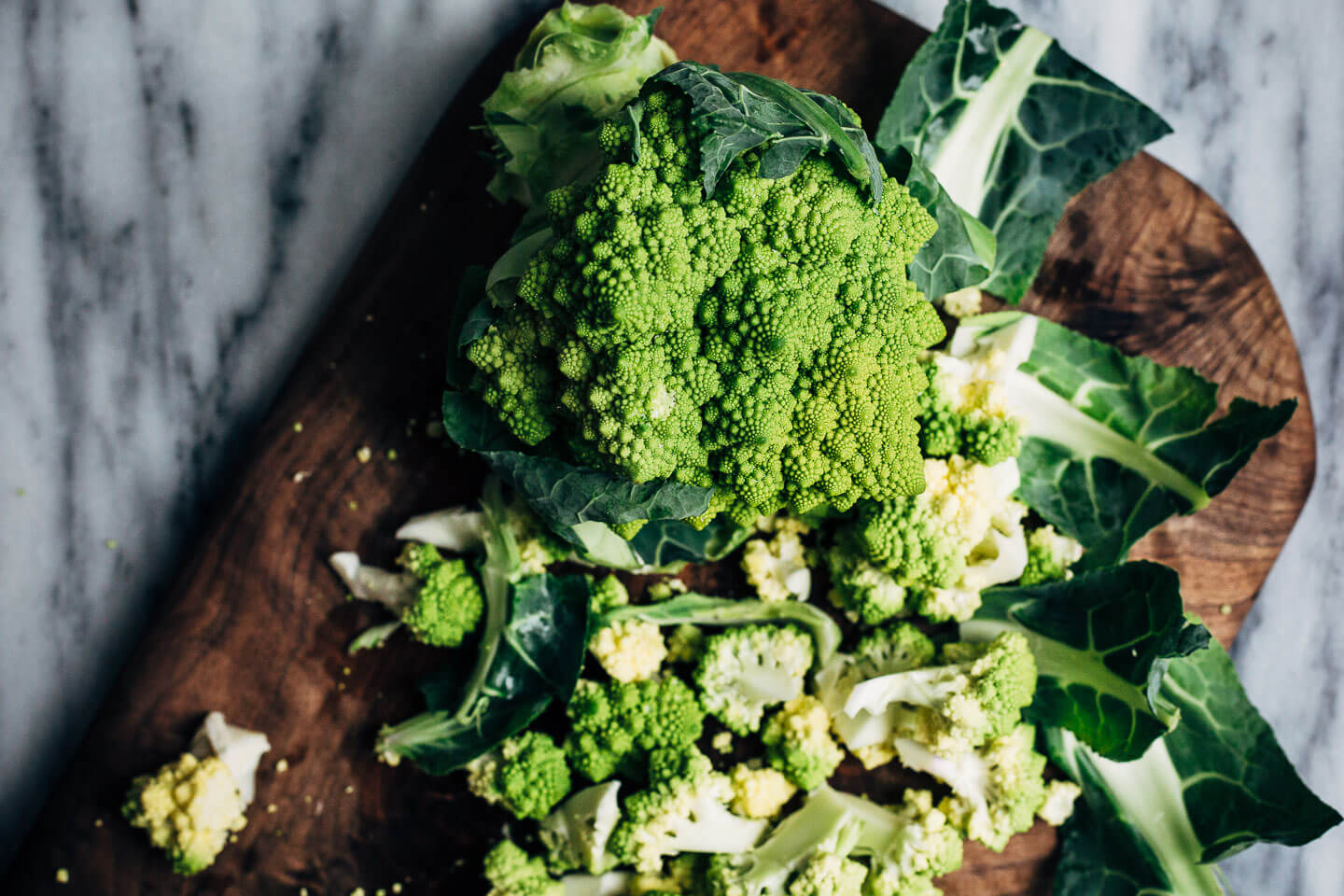 Keep winter eating interesting with this Whole30-compliant recipe for roasted Romanesco broccoli paired with a creamy vegan sunflower seed dressing made with soaked sunflower seeds and fresh Meyer lemons.