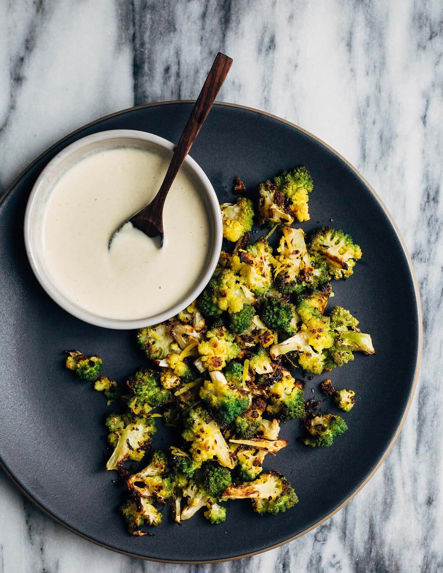 Keep winter eating interesting with this Whole30-compliant recipe for roasted Romanesco broccoli paired with a creamy vegan sunflower seed dressing made with soaked sunflower seeds and fresh Meyer lemons.