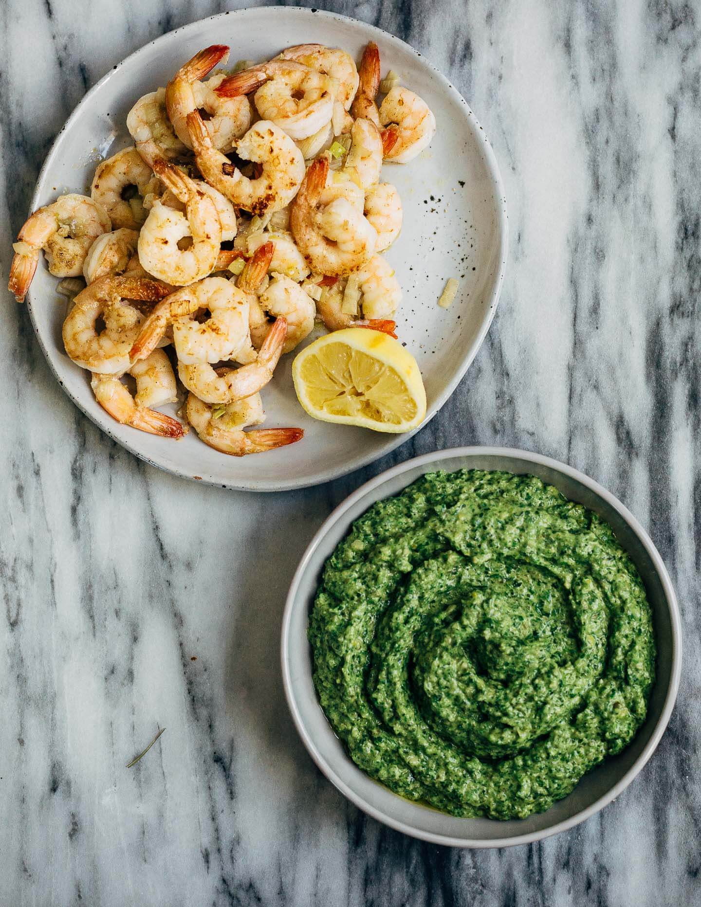 Celebrating the season's first shoots with a vibrant spring onion and chive pesto pasta tossed with sautéed shrimp that's perfect for dinner parties or a quick weeknight meal.