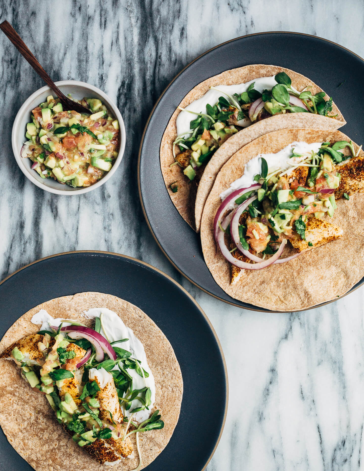 Simple broiled tilapia tacos that come together quickly under the broiler, making them perfect for weeknight meals. The tacos are topped with a tangly grapefruit-avocado salsa that contrasts beautifully with the spicy fish. 