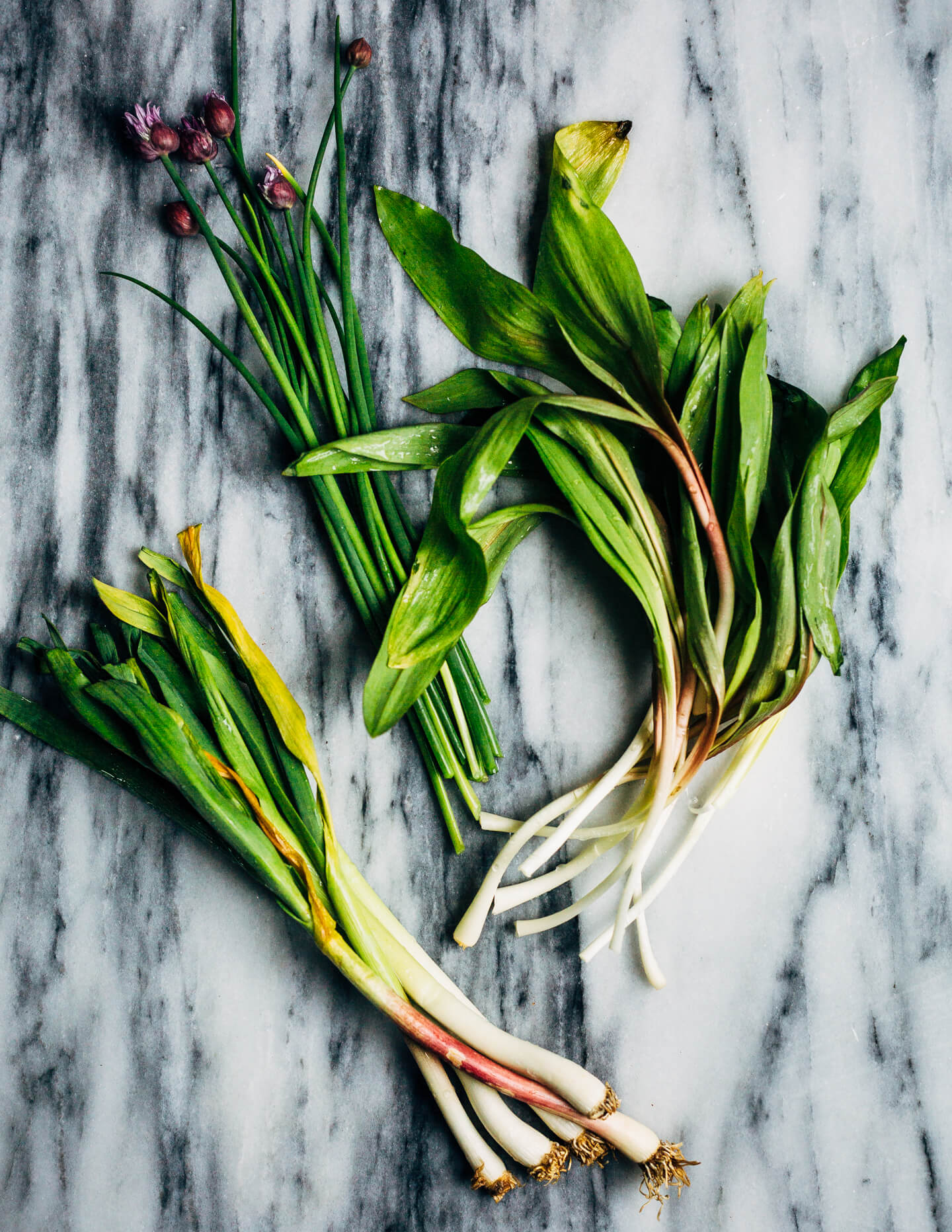 Ideal for Mother's Day brunch or spring gatherings, this sheet pan spinach quiche, made with ramps, green garlic, and chives, is a delicious way to feed a crowd. 