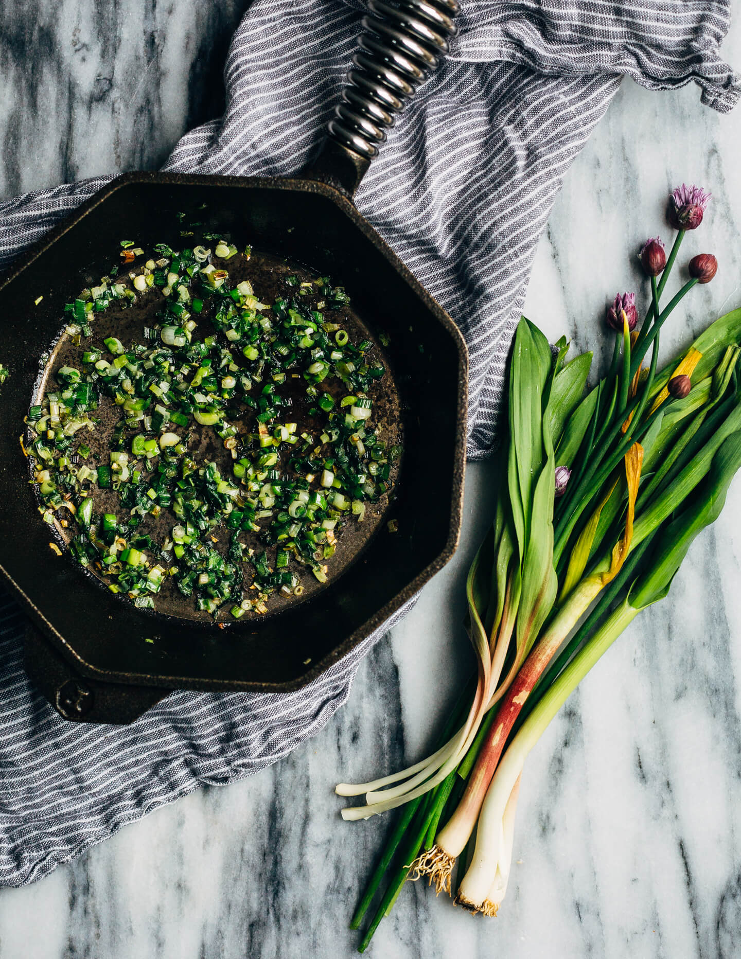 Ideal for Mother's Day brunch or spring gatherings, this sheet pan spinach quiche, made with ramps, green garlic, and chives, is a delicious way to feed a crowd. 