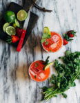 Pretty pink strawberry margaritas blended with an herbaceous cilantro, coriander, and black pepper simple syrup. These fresh strawberry margaritas are beautifully balanced and totally refreshing.