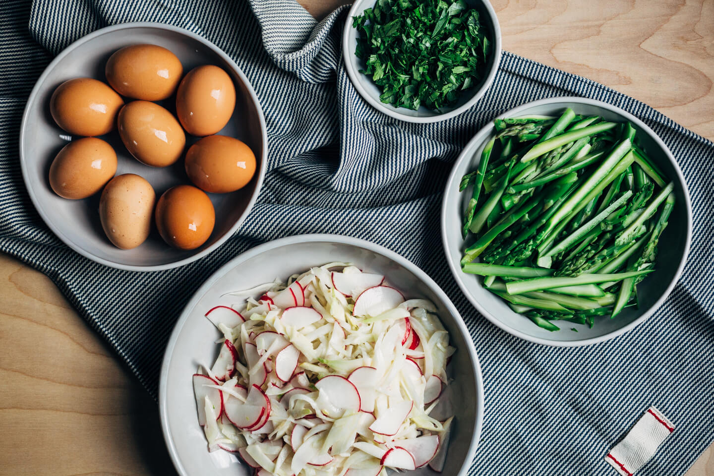 A substantial, spring-inspired fennel, radish, and asparagus salad with creamy buttermilk-lime dressing and steamed hard-boiled eggs. 