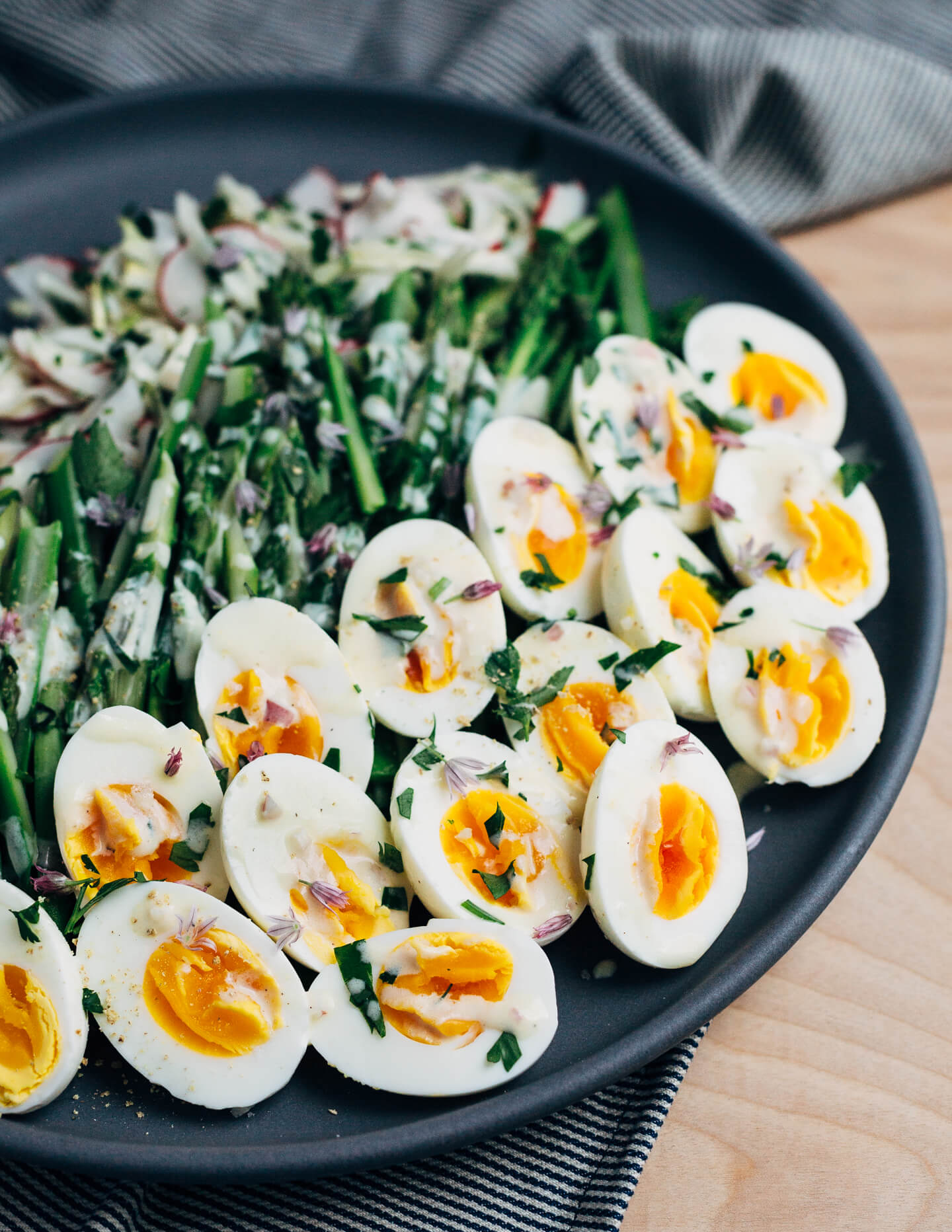 A substantial, spring-inspired fennel, radish, and asparagus salad with creamy buttermilk-lime dressing and steamed hard-boiled eggs. 