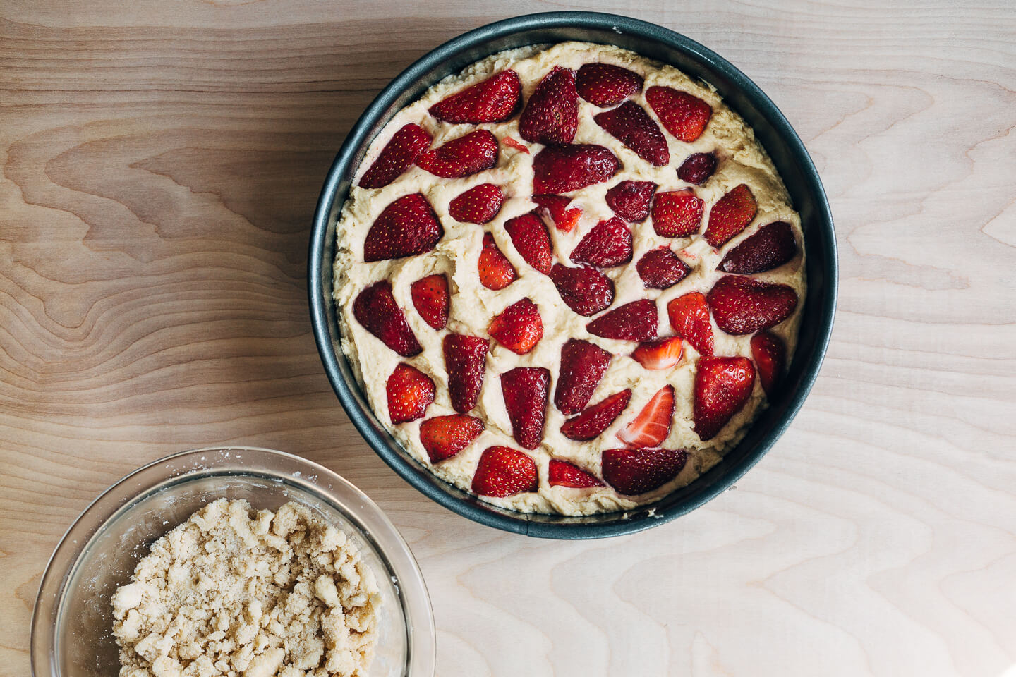 This strawberry crumb cake has a toothsome whole wheat crumb and is topped with ripe strawberries, a perfectly salty-sweet crumb topping, and unsweetened whipped cream. 