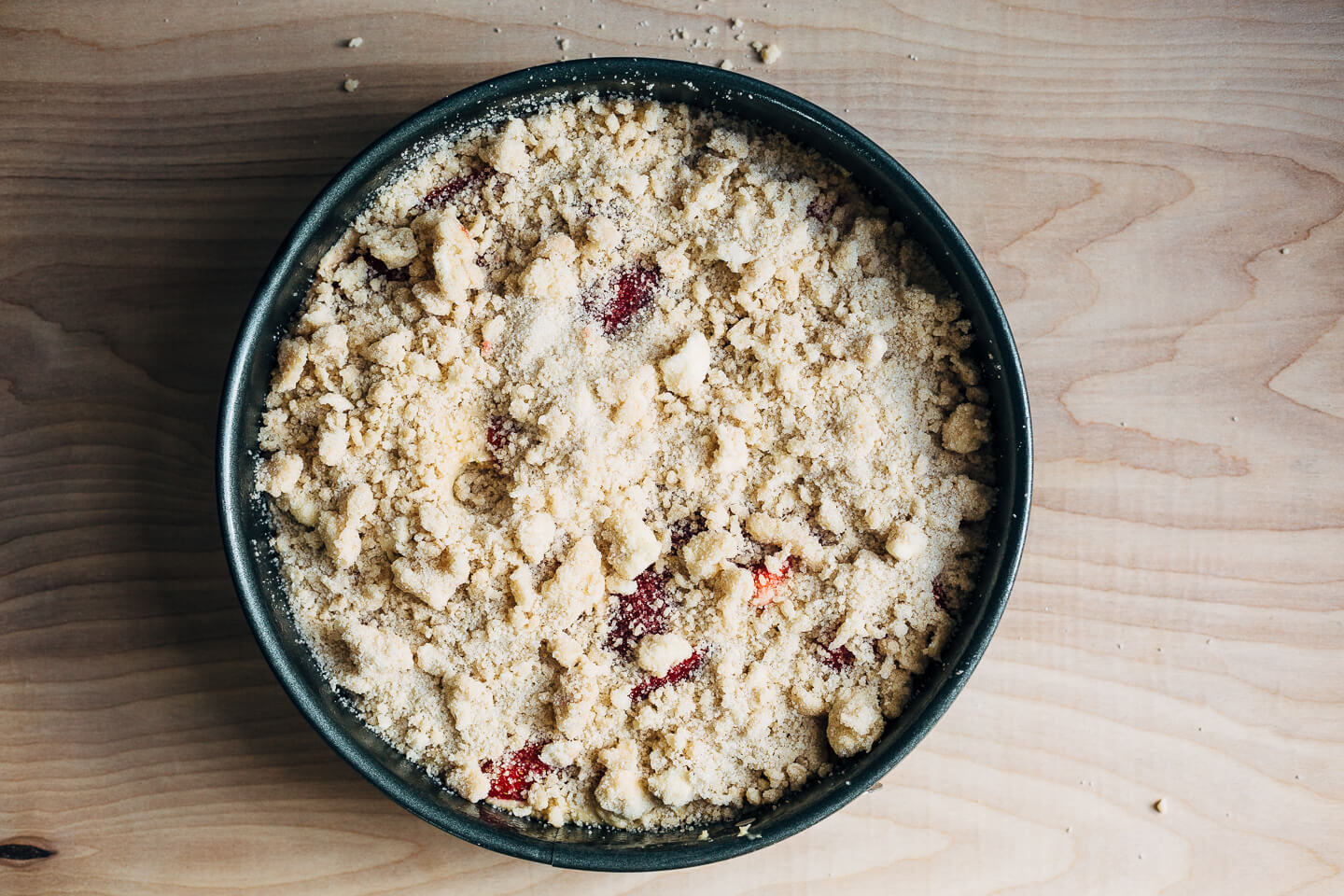 This strawberry crumb cake has a toothsome whole wheat crumb and is topped with ripe strawberries, a perfectly salty-sweet crumb topping, and unsweetened whipped cream. 