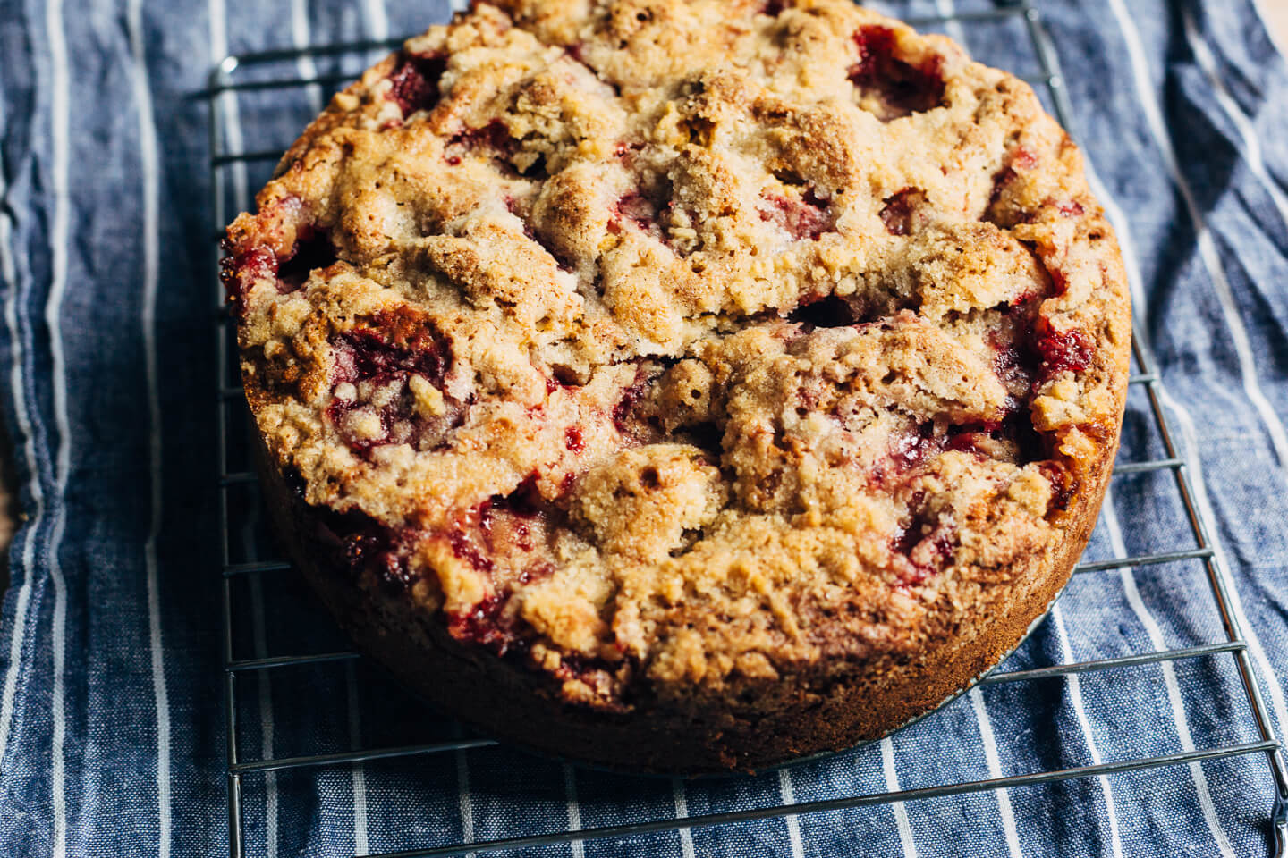 This strawberry crumb cake has a toothsome whole wheat crumb and is topped with ripe strawberries, a perfectly salty-sweet crumb topping, and unsweetened whipped cream. 