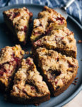 This strawberry crumb cake has a toothsome whole wheat crumb and is topped with ripe strawberries, a perfectly salty-sweet crumb topping, and unsweetened whipped cream.