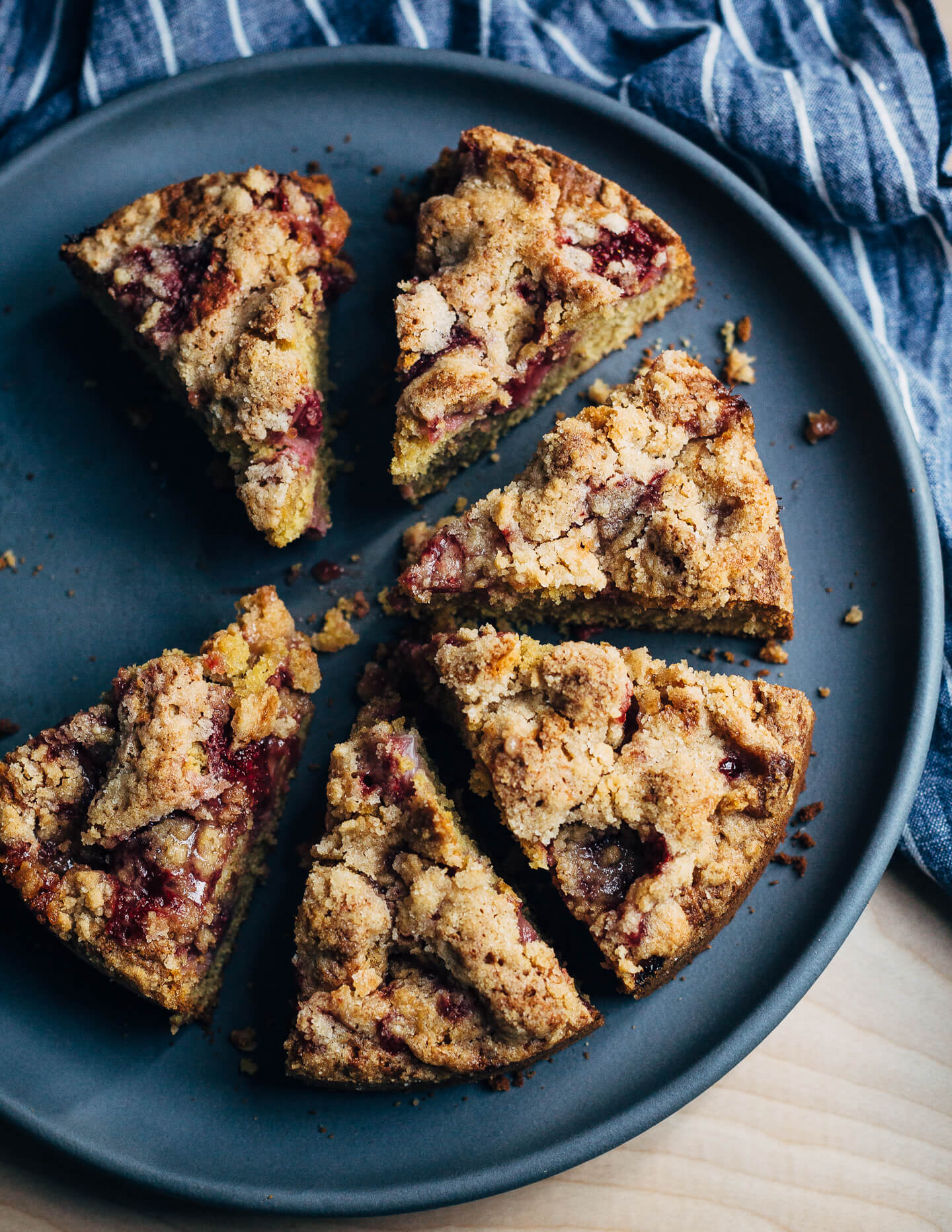 This strawberry crumb cake has a toothsome whole wheat crumb and is topped with ripe strawberries, a perfectly salty-sweet crumb topping, and unsweetened whipped cream. 