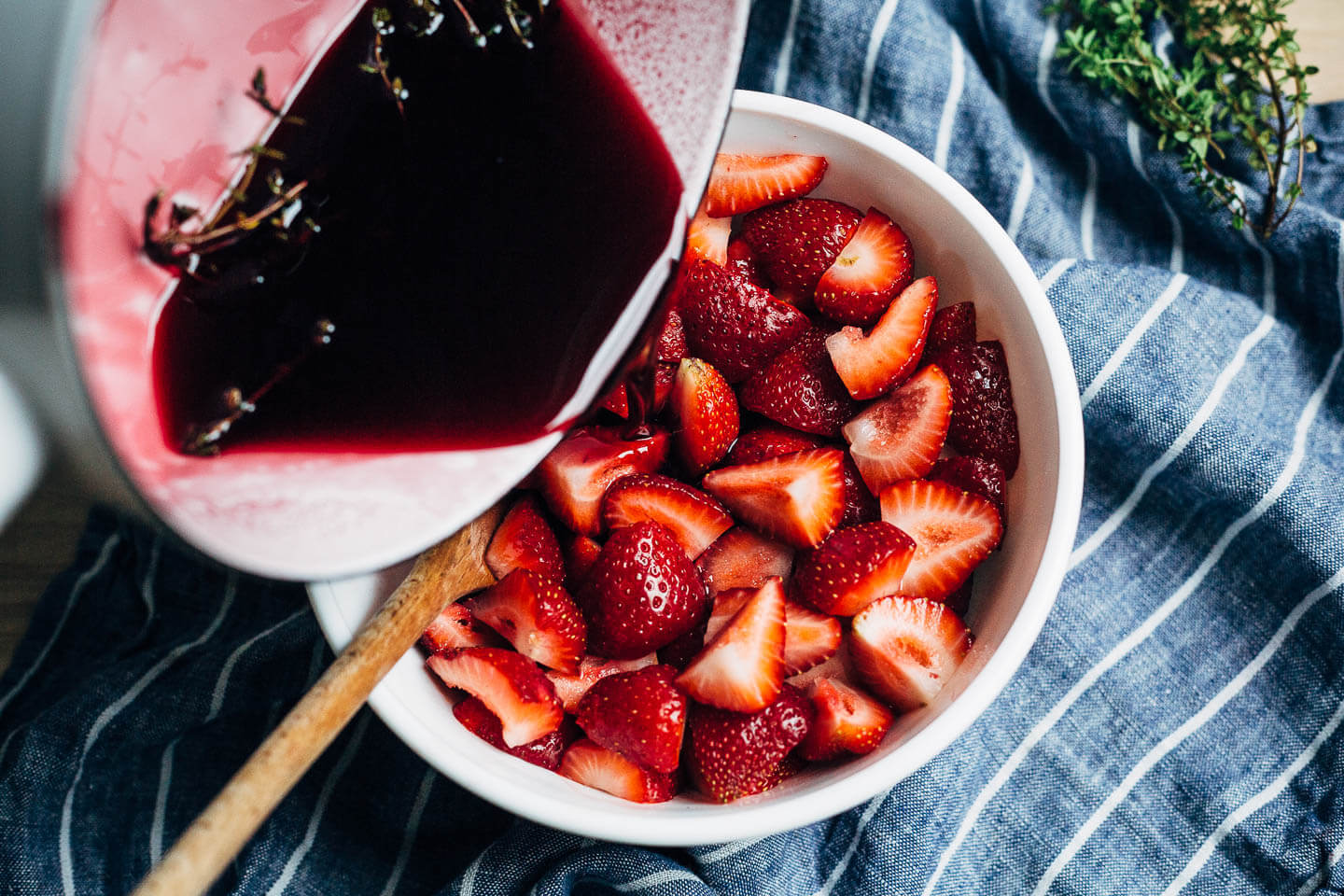 Ripe strawberries in red wine is the kind of effortless summer dessert that we all need more of. With hints of lemon and fresh thyme, the red wine reduction melds beautifully with ripe strawberries and is perfect spooned over vanilla ice cream. 