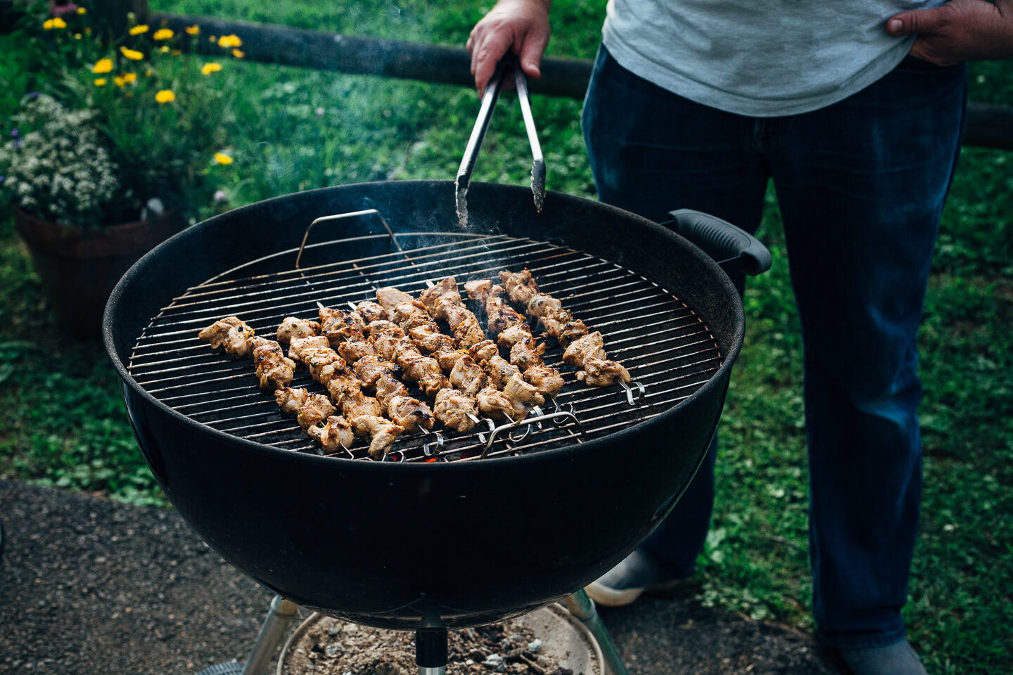 Deliciously tender lemon- and yogurt-marinated grilled chicken kebobs make for a vibrant summer cookout. The grilled chicken skewers are served alongside grilled flatbreads, tzatziki, and an herbed salad made with grilled zucchini, tomato, and red onion.