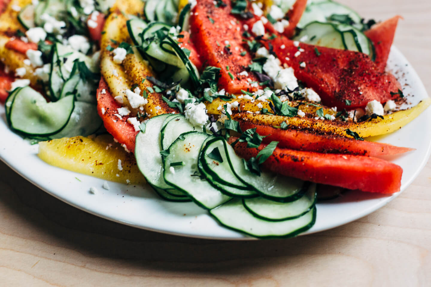 A refreshing cucumber-watermelon salad that pairs spicy-sweet watermelon wedges with lime-infused cucumbers. Spicy and cooling, this effortless summer salad is a knockout. 