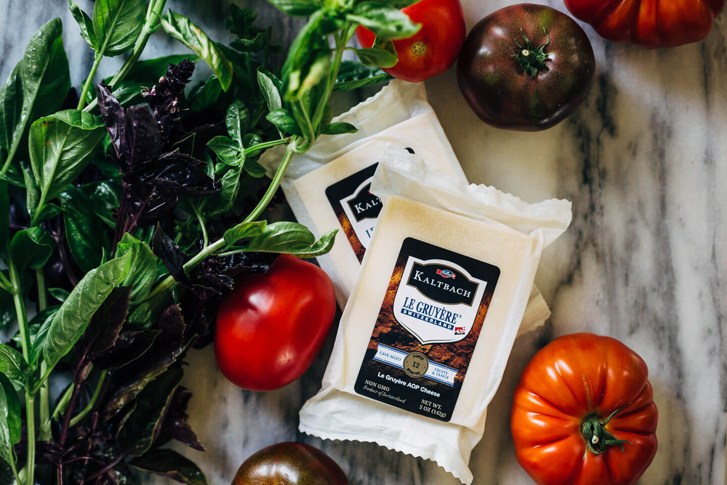 Celebrating the height of tomato season with sumptuous Gruyere and roasted tomato tartines made with thick-cut sourdough and punchy garlic butter.