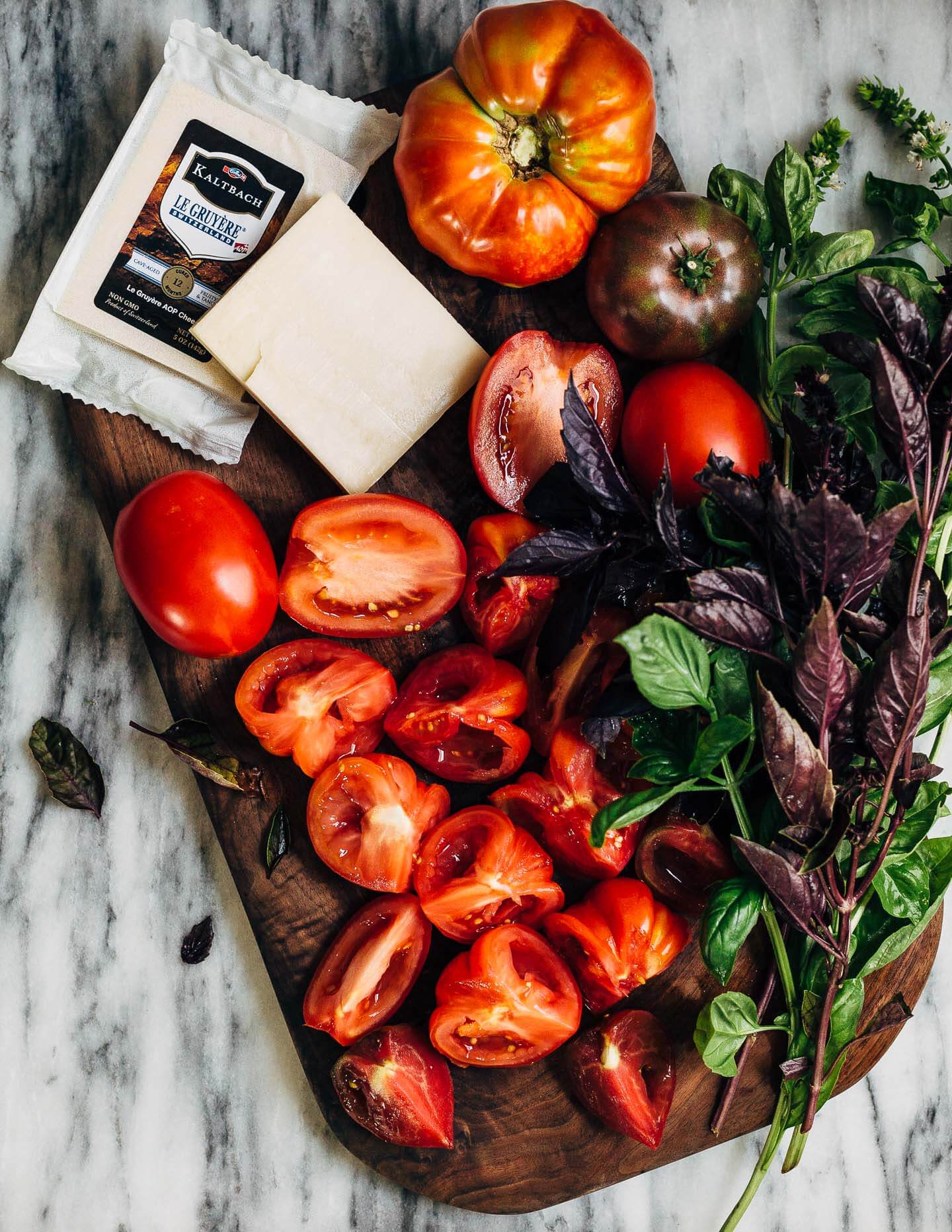 Celebrating the height of tomato season with sumptuous Gruyere and roasted tomato tartines made with thick-cut sourdough and punchy garlic butter.