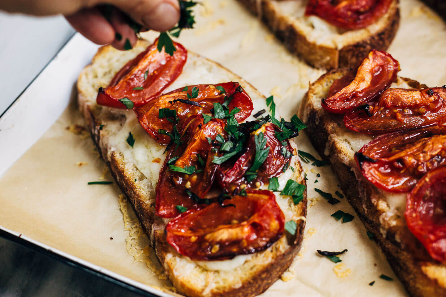 Celebrating the height of tomato season with sumptuous Gruyere and roasted tomato tartines made with thick-cut sourdough and punchy garlic butter.