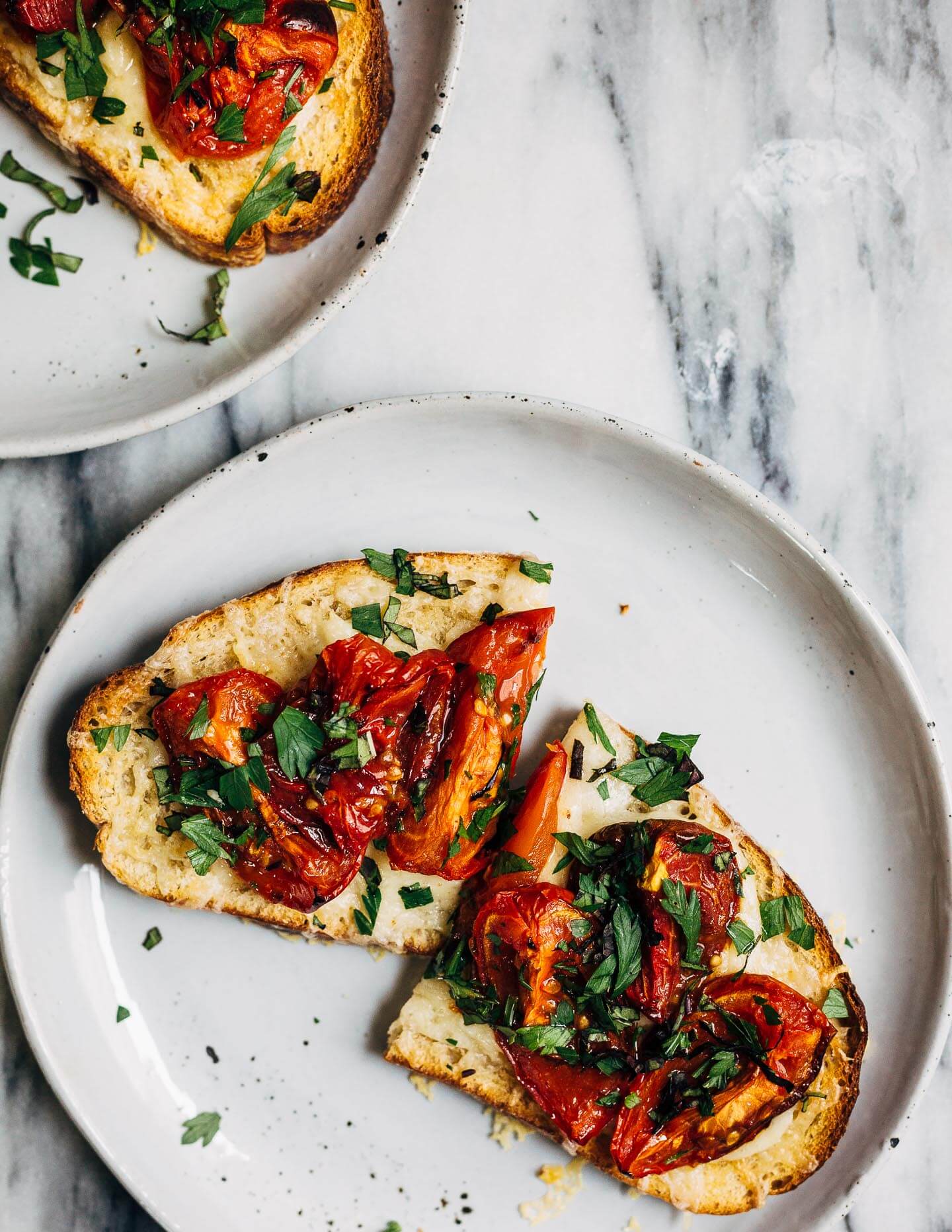 Celebrating the height of tomato season with sumptuous Gruyere and roasted tomato tartines made with thick-cut sourdough and punchy garlic butter.