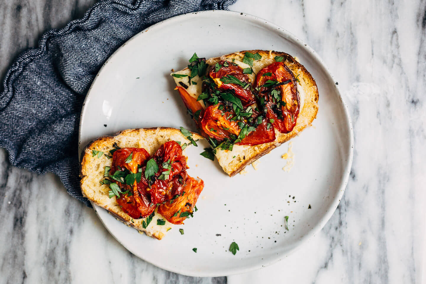 Celebrating the height of tomato season with sumptuous Gruyere and roasted tomato tartines made with thick-cut sourdough and punchy garlic butter.