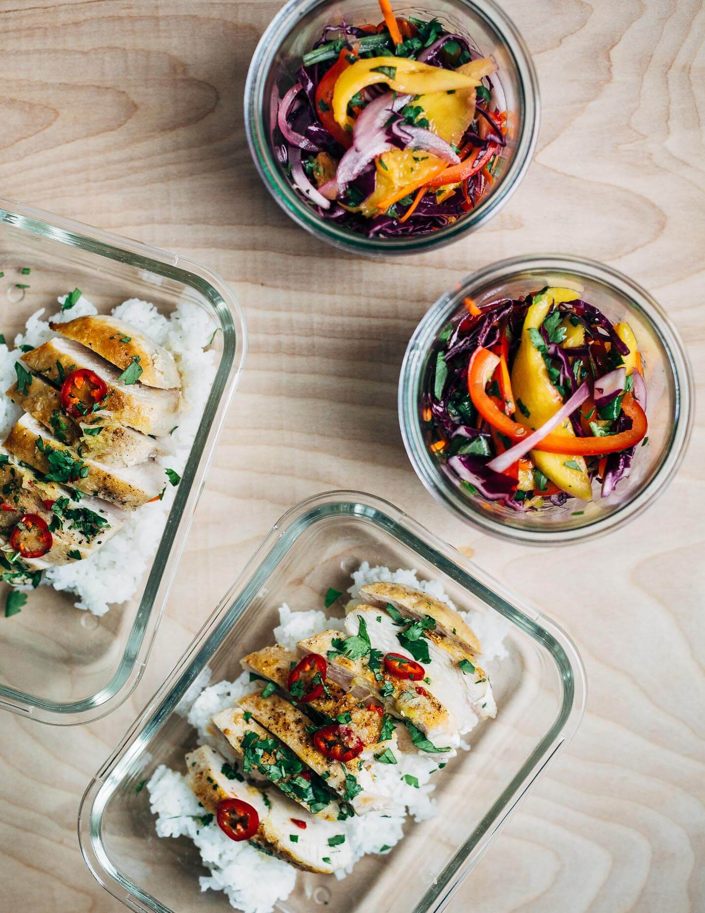 Inspired by Thai flavors, this meal prep chicken features juicy pan-seared chicken breast is served alongside a vibrant red cabbage and mango slaw and sticky jasmine rice.